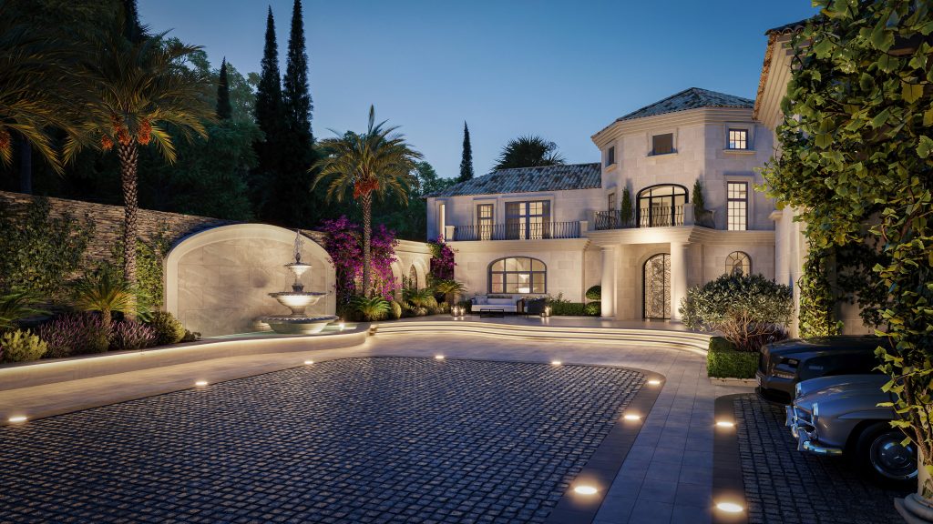 Villa facade at dusk with an illuminated fountain, cobbled forecourt and garden lighting in La Zagaleta